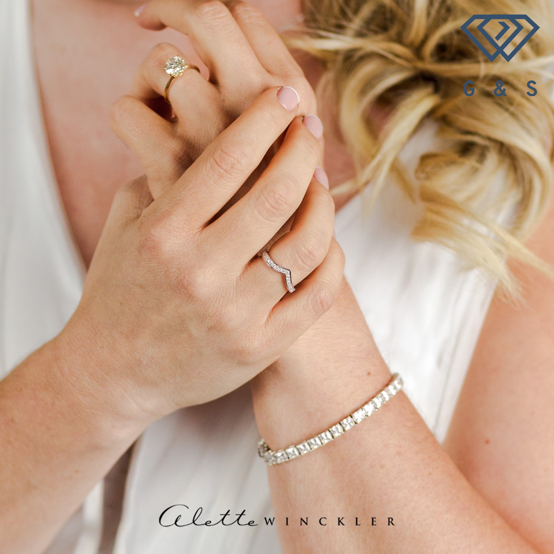 This ring showcases a unique wishbone design that wraps around the entire finger, adorned with shimmering pave-set moissanites for endless sparkle.