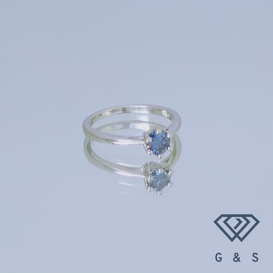 A classic solitaire ring with a 0.50ct blue moissanite, set in sterling silver with a beautiful floral basket detail.