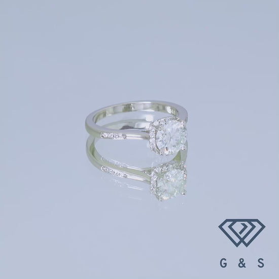 A modern and elegant engagement ring, showcasing a 1.00ct moissanite with a halo setting, designed for a contemporary aesthetic in sterling silver.
