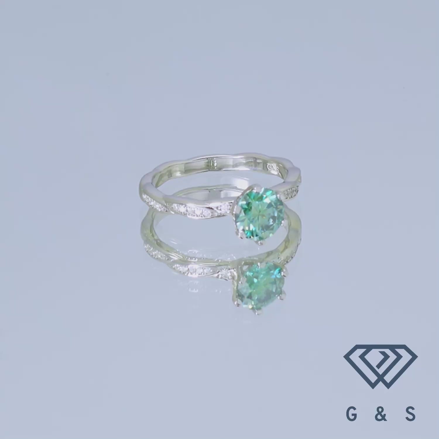 This elegant ring features a 1.00ct green moissanite with a vintage aesthetic, set in a finely crafted sterling silver band.