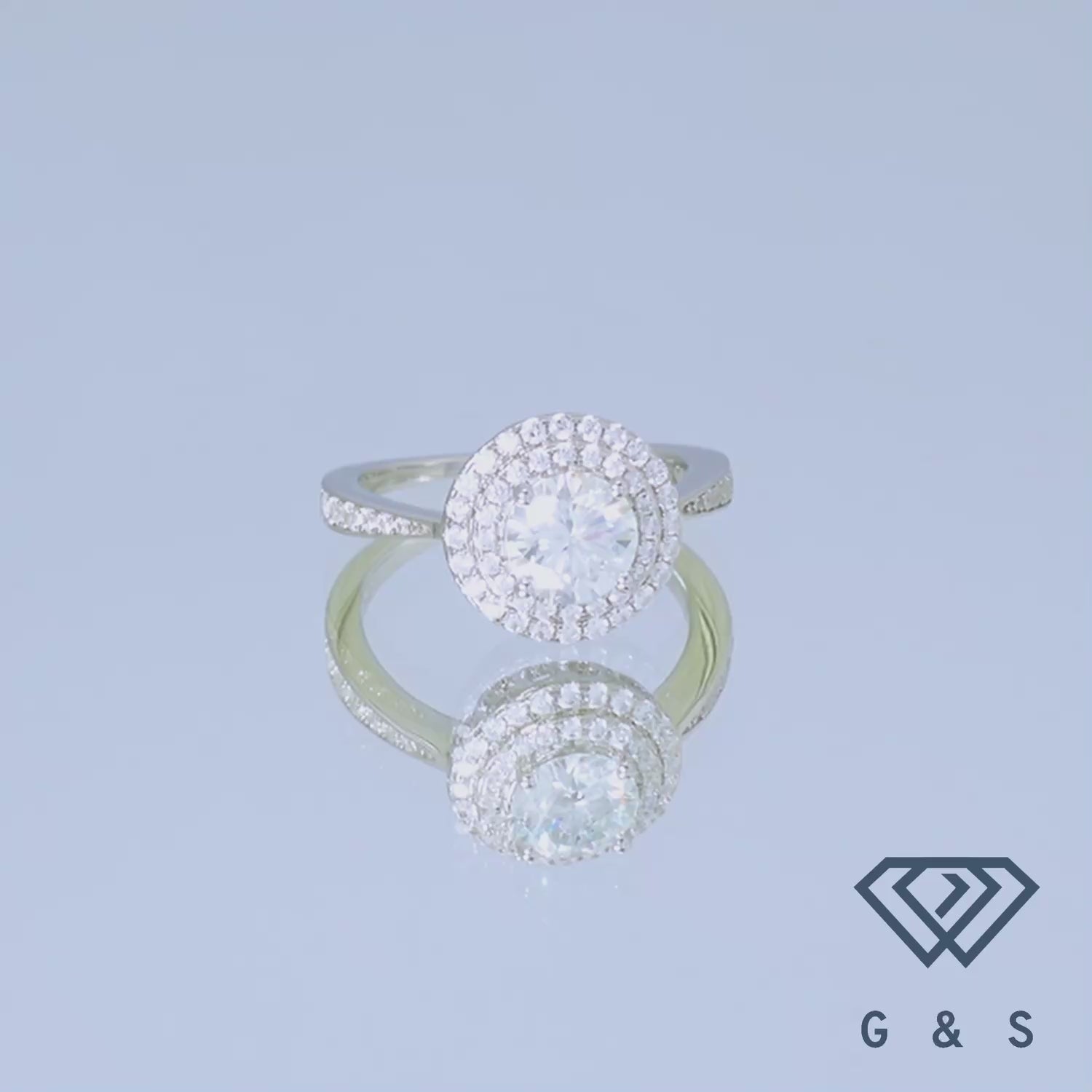 A sophisticated engagement ring with a 1.00ct round brilliant moissanite and a double halo design for added grandeur.