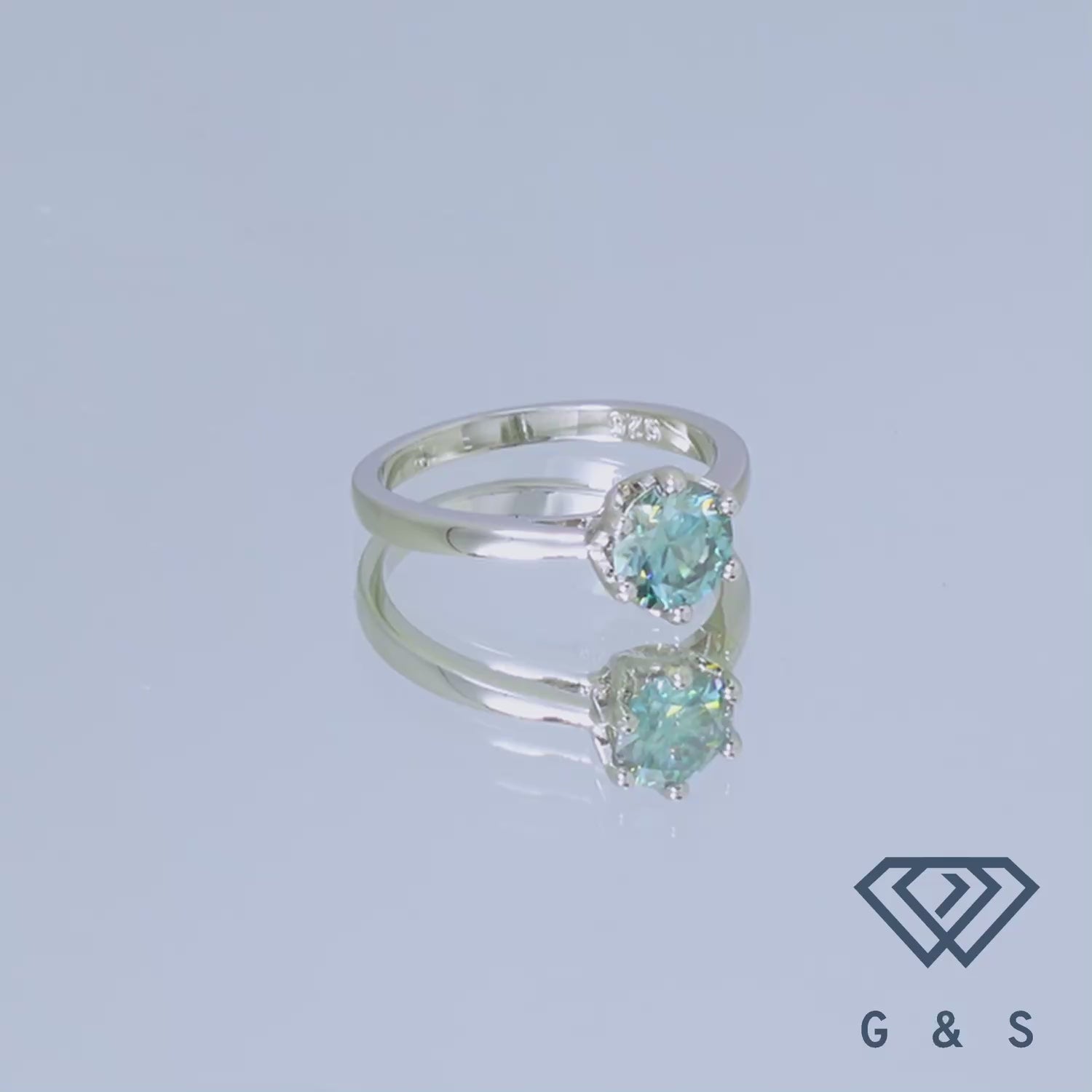 This elegant sterling silver ring features a 1.00ct green moissanite in a unique six-prong floral basket design.