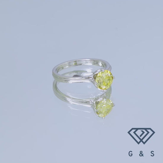 This elegant ring features a brilliant 1.00ct yellow moissanite, set in a classic tulip solitaire design crafted in polished sterling silver, perfect for a subtle yet eye-catching engagement.