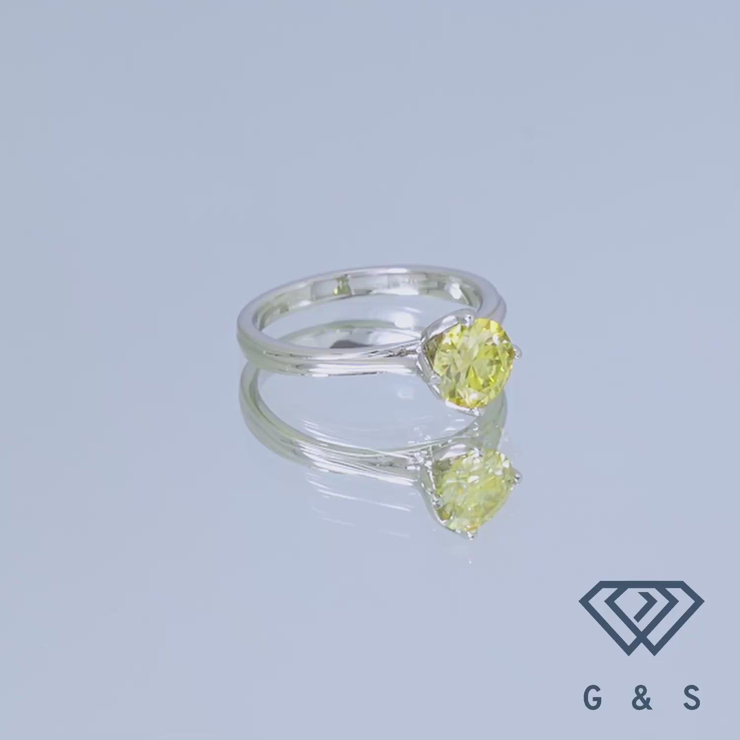 This elegant ring features a brilliant 1.00ct yellow moissanite, set in a classic tulip solitaire design crafted in polished sterling silver, perfect for a subtle yet eye-catching engagement.