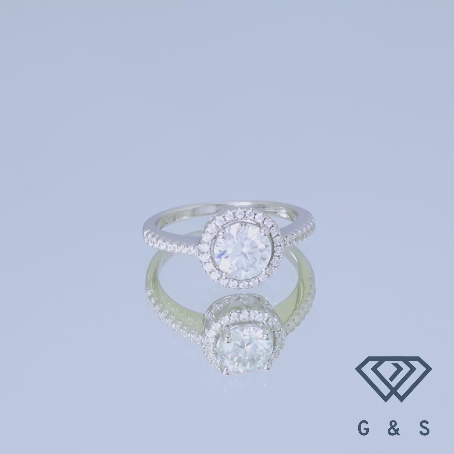 Showcasing the unique heart-shaped halo design around a brilliant 1.00ct moissanite, set in a polished sterling silver band.