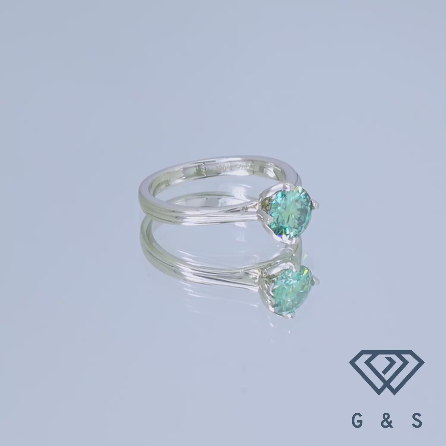 Featuring a vibrant 1.00ct green moissanite, this ring's delicate tulip design is beautifully showcased in sterling silver.