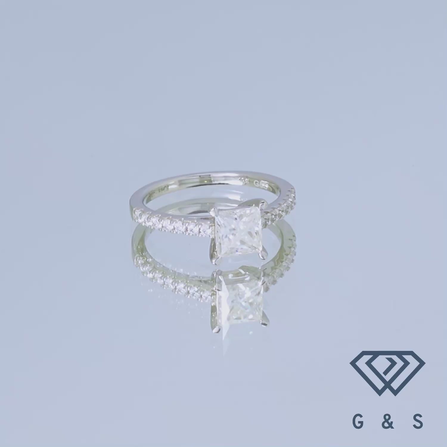 A stunning engagement ring with a 1.00ct princess cut moissanite showcased in a classic basket-style setting.