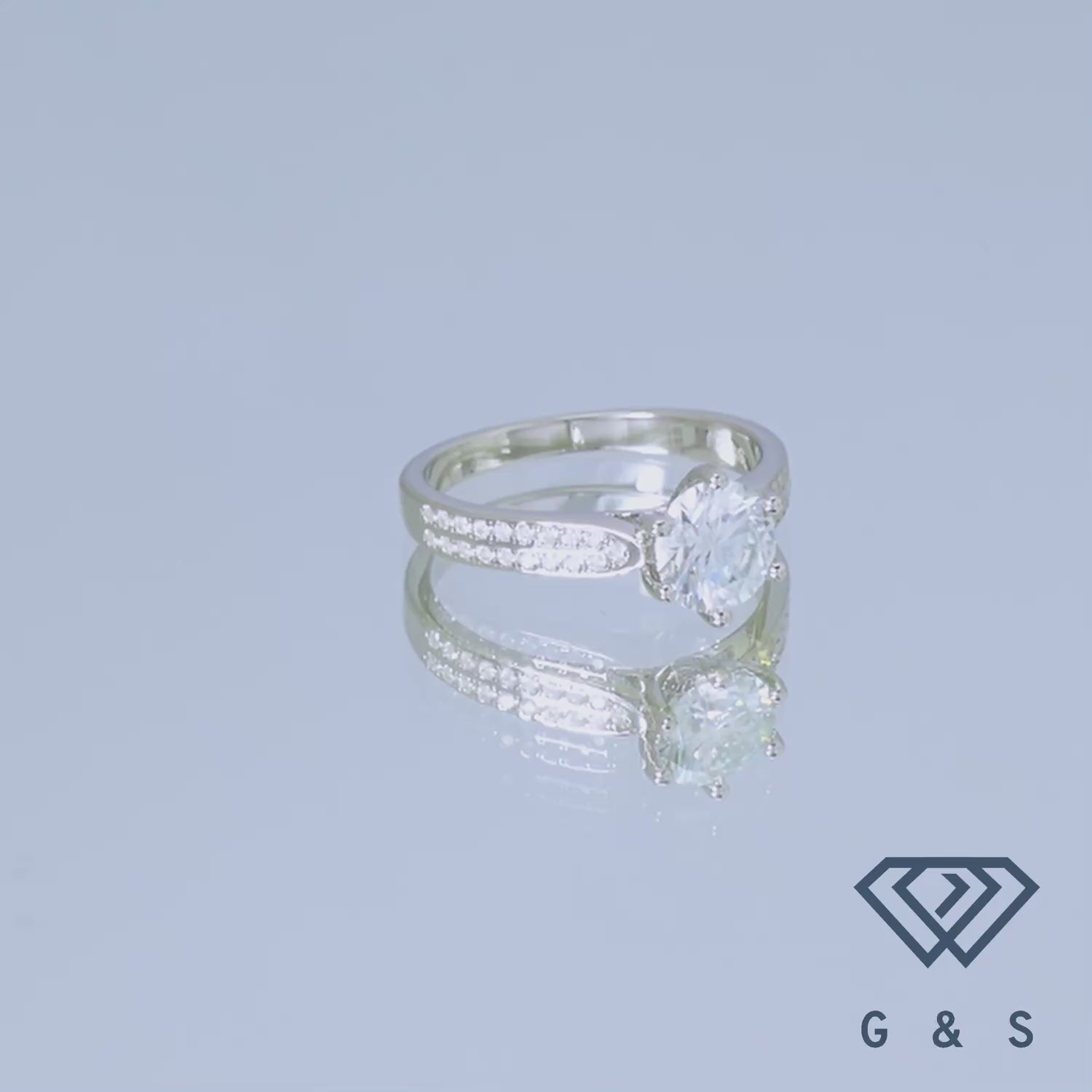 A classic and elegant engagement ring featuring a 1.00ct moissanite center stone and a sparkling pave band, all set in high-quality sterling silver.