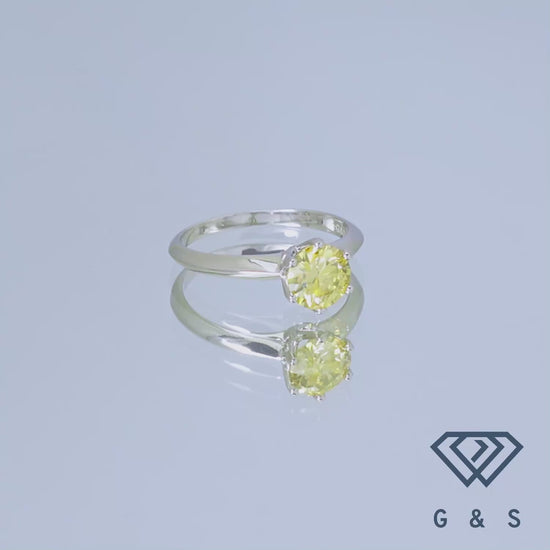 A simple and elegant sterling silver ring featuring a 1.00ct yellow moissanite, set in the iconic six-prong Tiffany style.