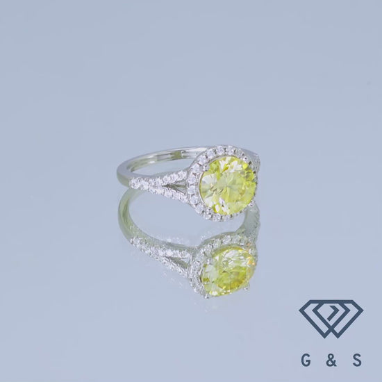 This ring features a brilliant 2.00ct moissanite with a distinctive yellow halo, offering a modern and luxurious alternative to traditional diamond rings.