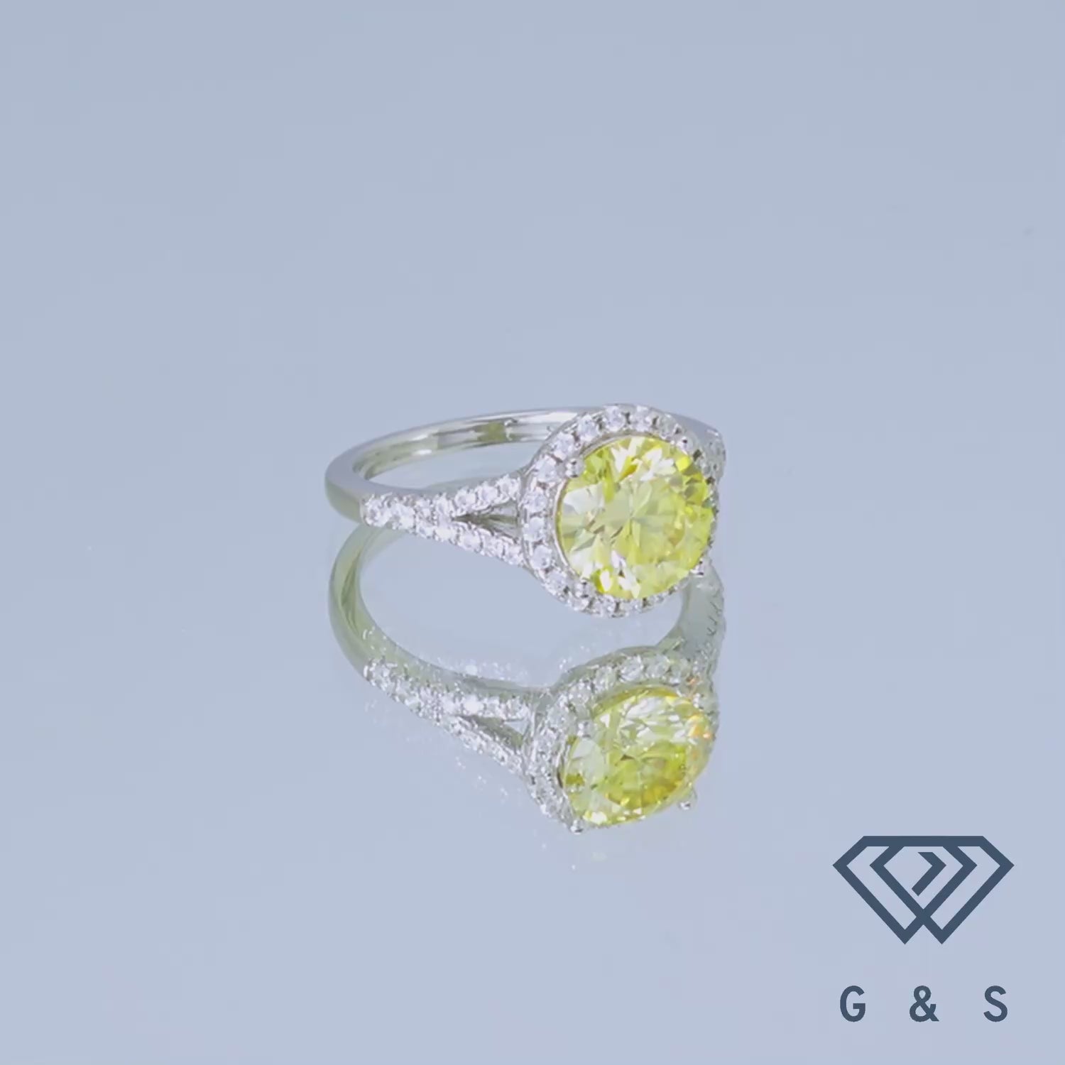 This ring features a brilliant 2.00ct moissanite with a distinctive yellow halo, offering a modern and luxurious alternative to traditional diamond rings.