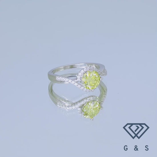 This stunning ring showcases a brilliant 1.00ct yellow moissanite, enhanced by a sparkling halo, creating a luxurious and eye-catching design in a classic sterling silver setting.