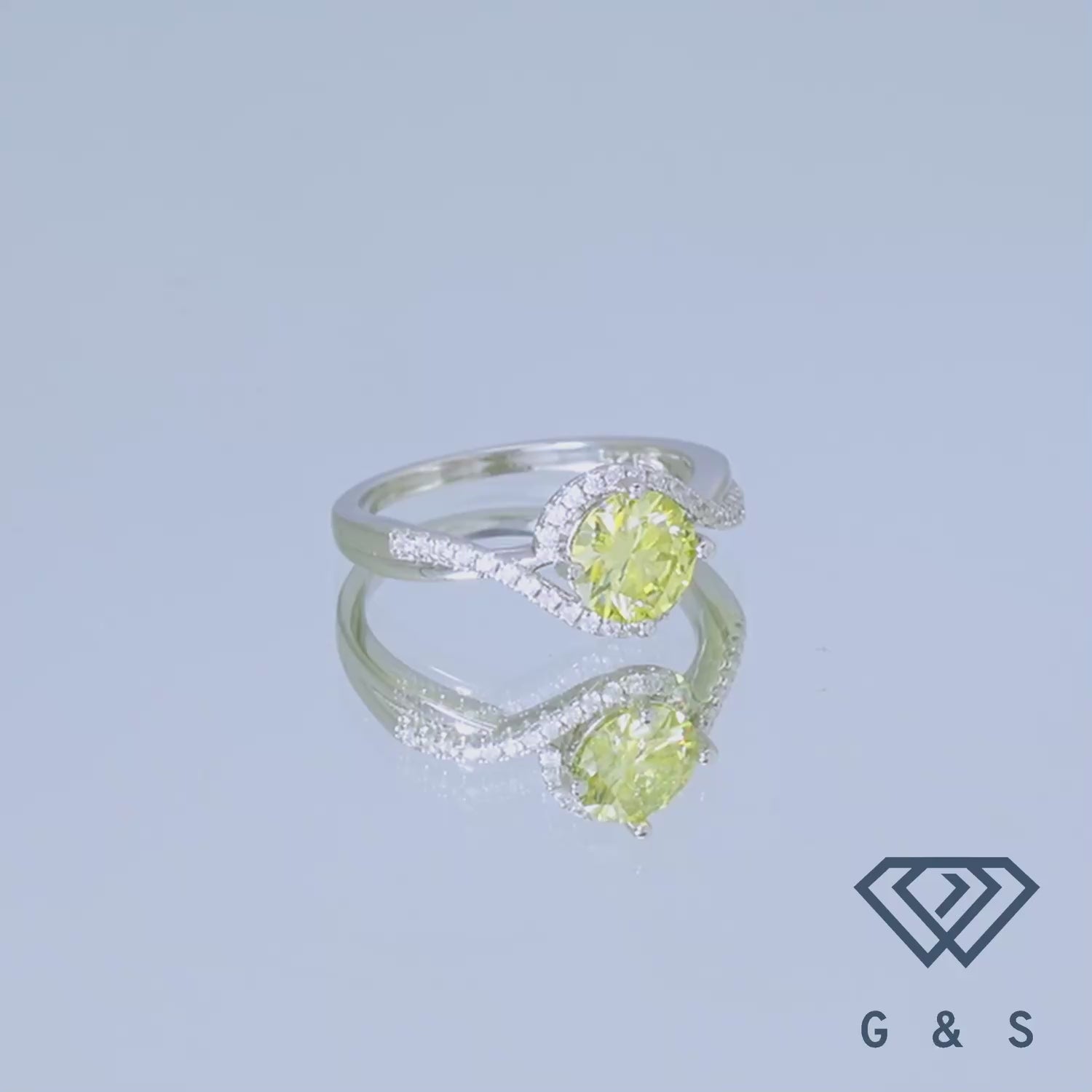 This stunning ring showcases a brilliant 1.00ct yellow moissanite, enhanced by a sparkling halo, creating a luxurious and eye-catching design in a classic sterling silver setting.