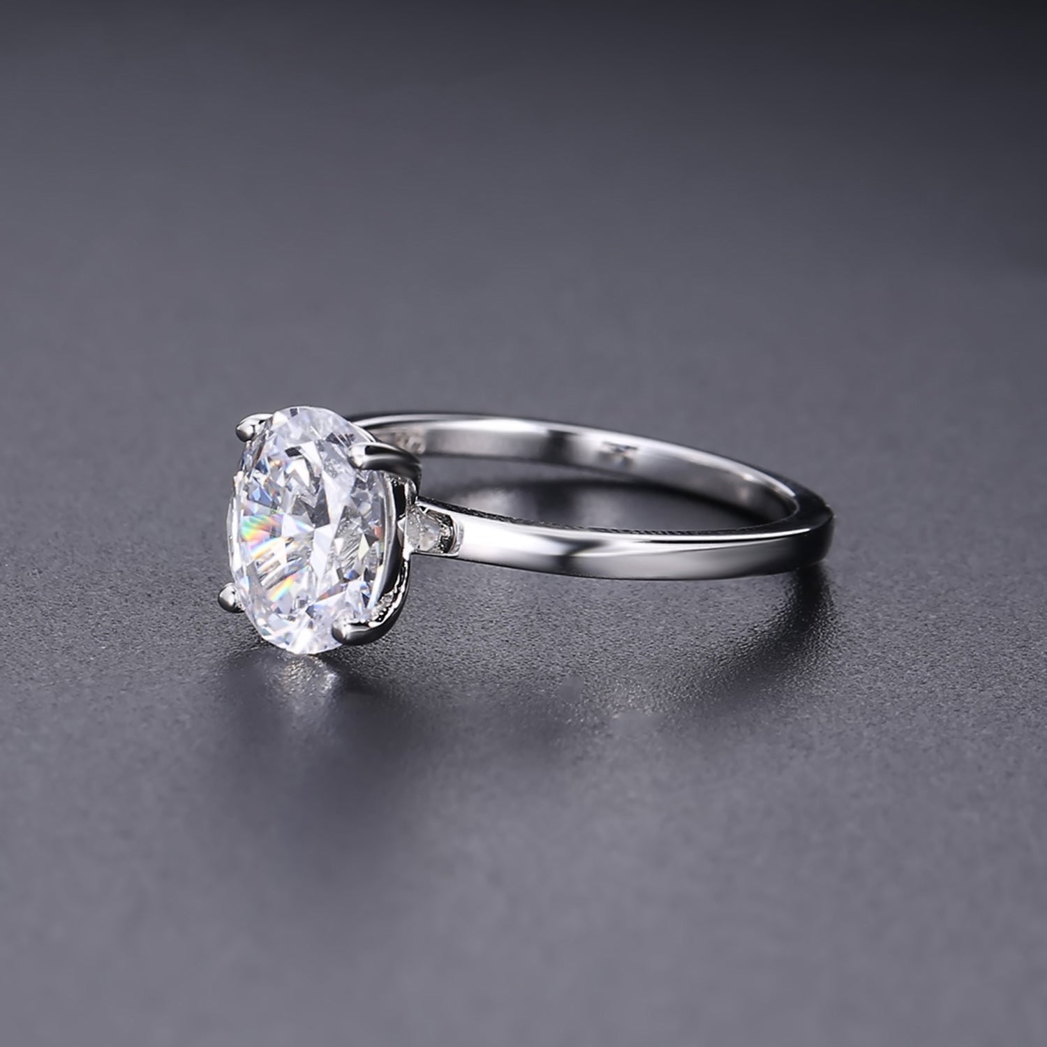 This classic ring features a brilliant 1.00ct oval moissanite held securely by four prongs.