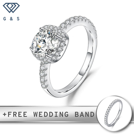 A delicate sterling silver engagement ring featuring a 0.50ct moissanite center stone surrounded by a sparkling halo.