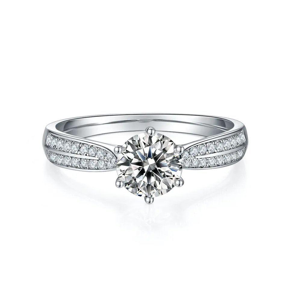 This elegant ring showcases a brilliant moissanite center stone, accented by a sparkling pave band of smaller moissanites, set in high-quality sterling silver.