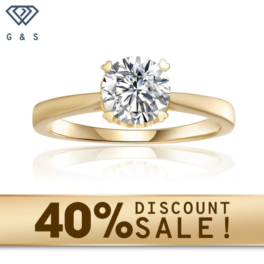A classic engagement ring featuring a 1.00ct moissanite set with delicate heart-shaped prongs in 9ct yellow gold.
