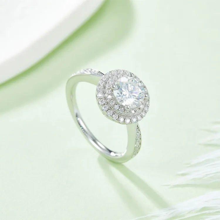 A brilliant 1.00ct round moissanite engagement ring with a double halo setting for exceptional radiance.