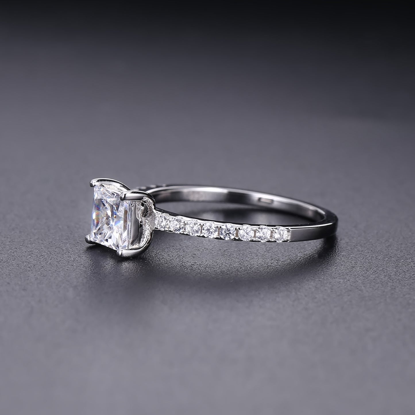 A beautiful and affordable engagement ring featuring a sparkling 1.20ct princess cut moissanite in a sleek sterling silver setting.