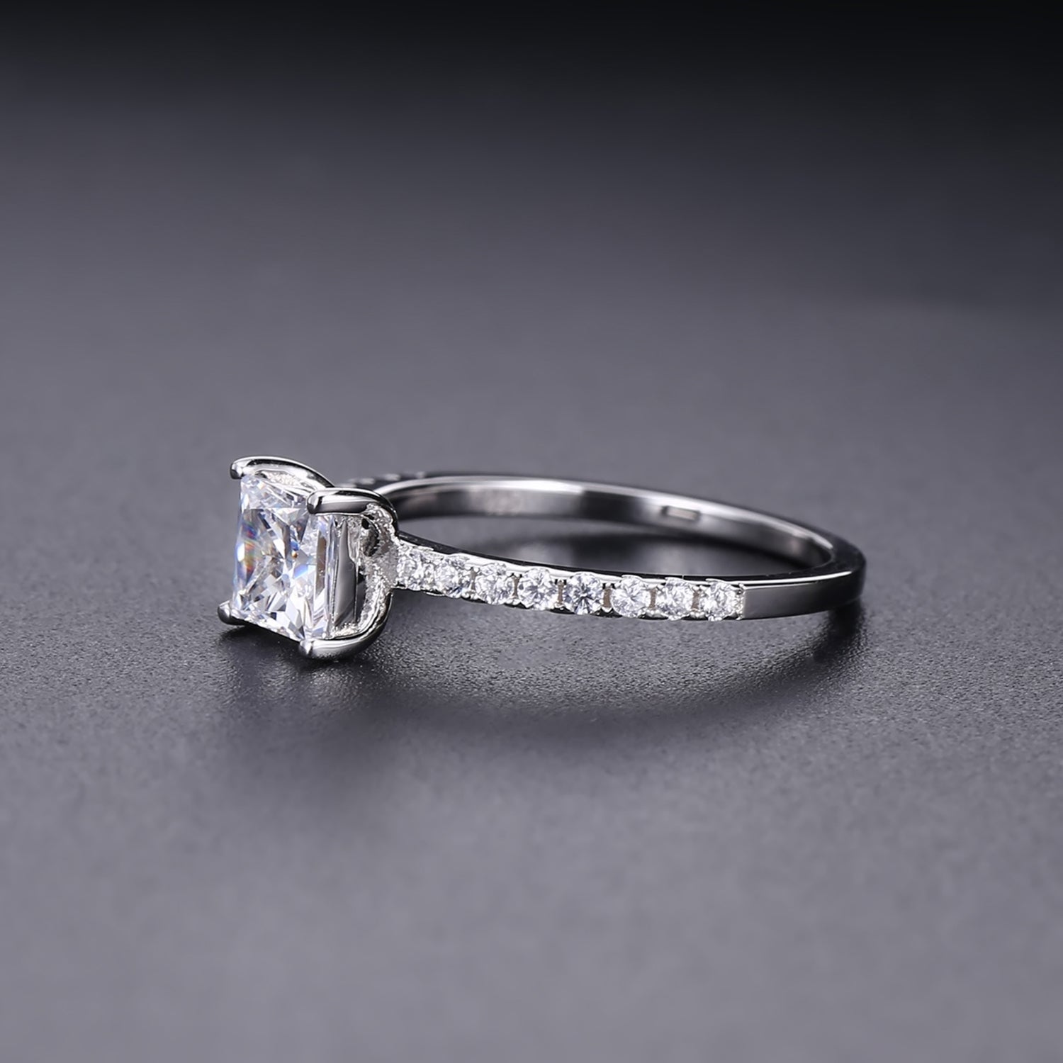 A beautiful and affordable engagement ring featuring a sparkling 1.20ct princess cut moissanite in a sleek sterling silver setting.