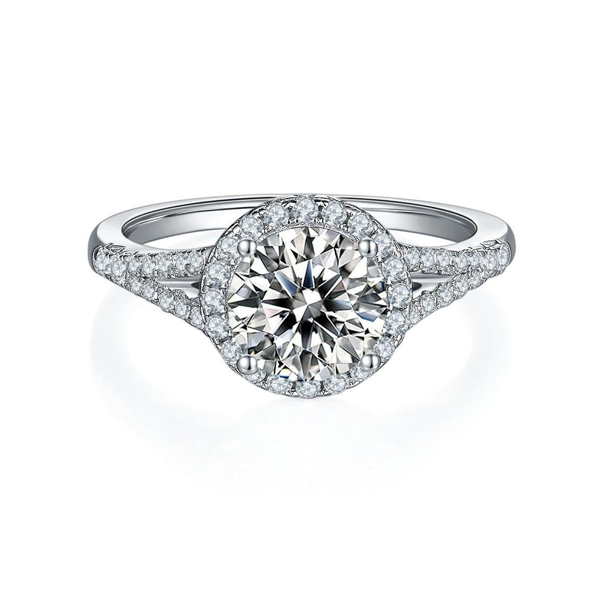 A luxurious engagement ring with a 1.50ct moissanite center stone, a halo of smaller stones, and a pave-set band for extra sparkle.