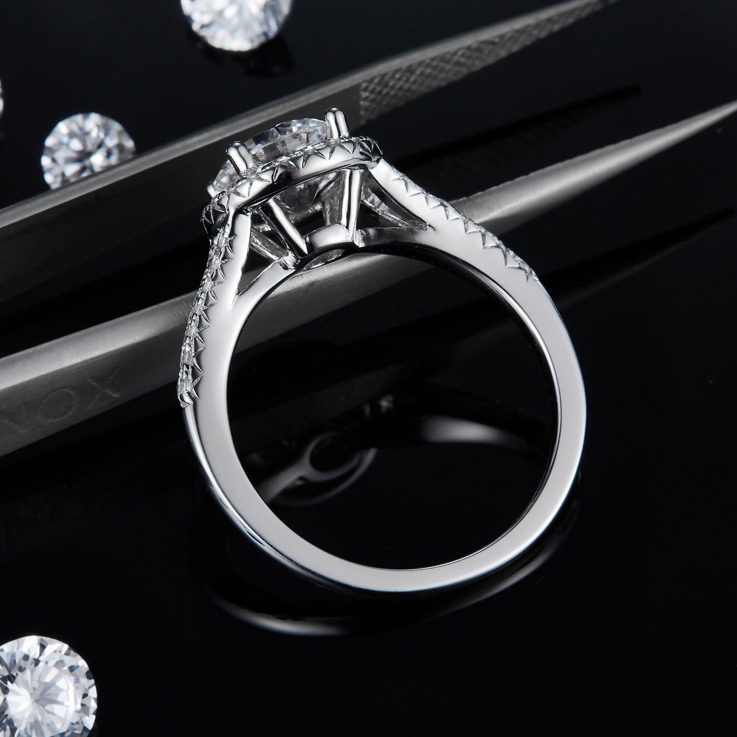 A timeless engagement ring featuring a 1.50ct moissanite center stone and a traditional halo design.
