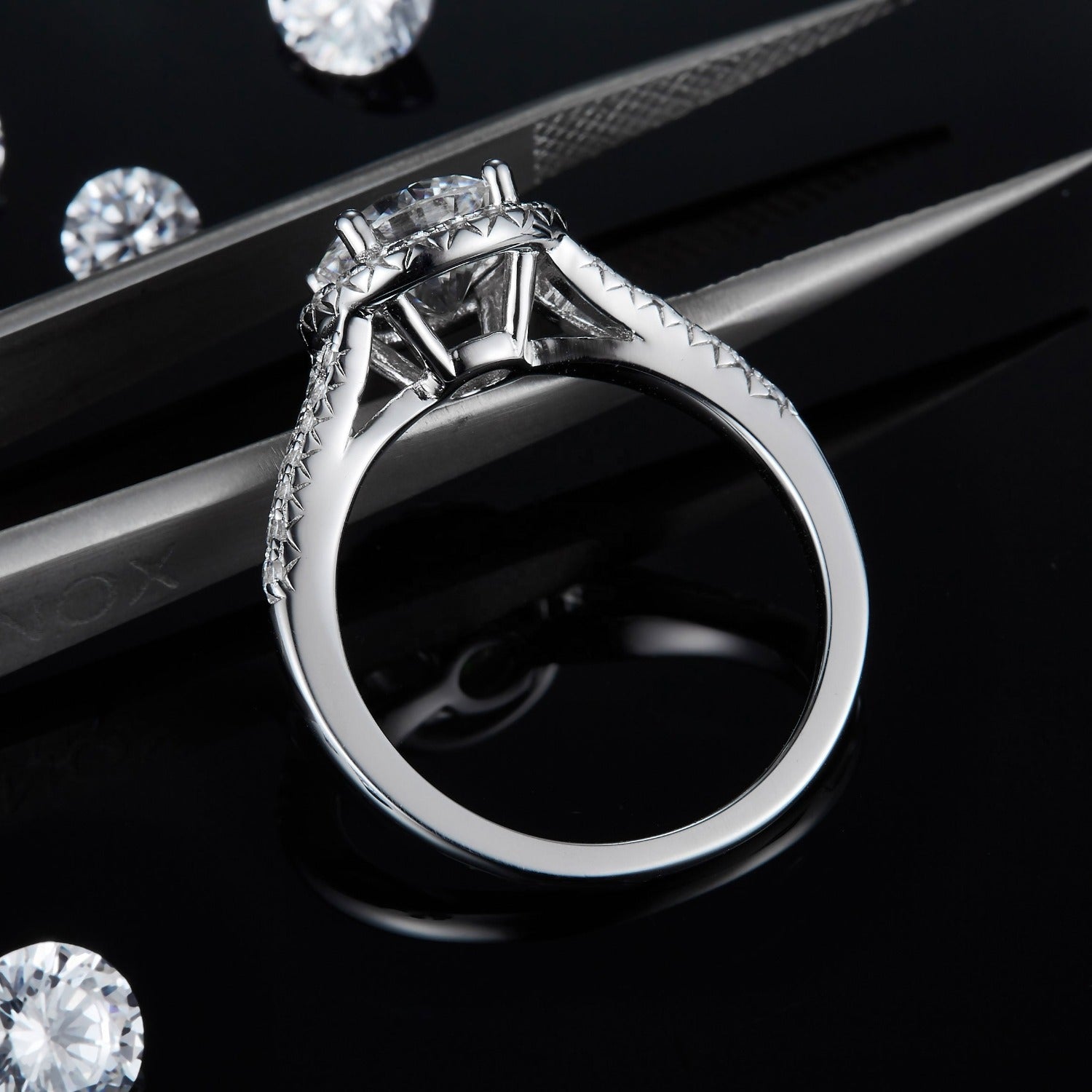 A timeless engagement ring featuring a 1.50ct moissanite center stone and a traditional halo design.