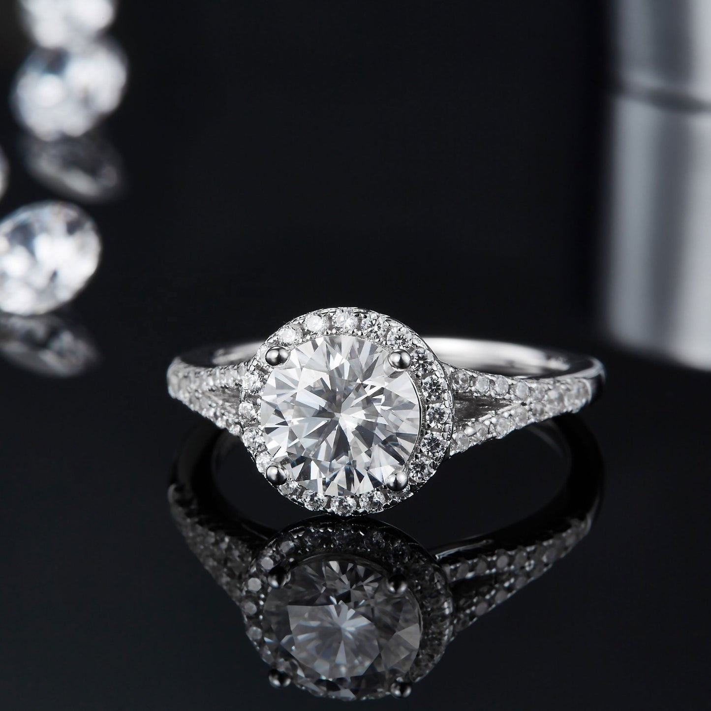 This ring features a dazzling 1.50ct moissanite center stone, surrounded by a halo of shimmering stones, creating a radiant look.