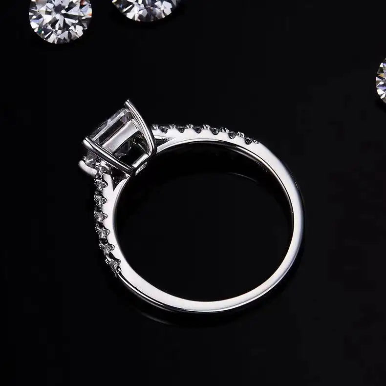 A simple yet elegant solitaire ring featuring a 1.00ct princess cut moissanite in a refined basket setting.