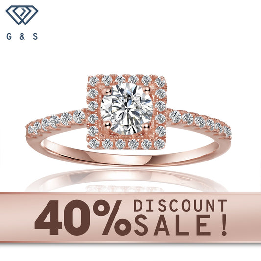 Elegant 9ct rose gold engagement ring featuring a 0.50ct moissanite with a delicate halo setting.