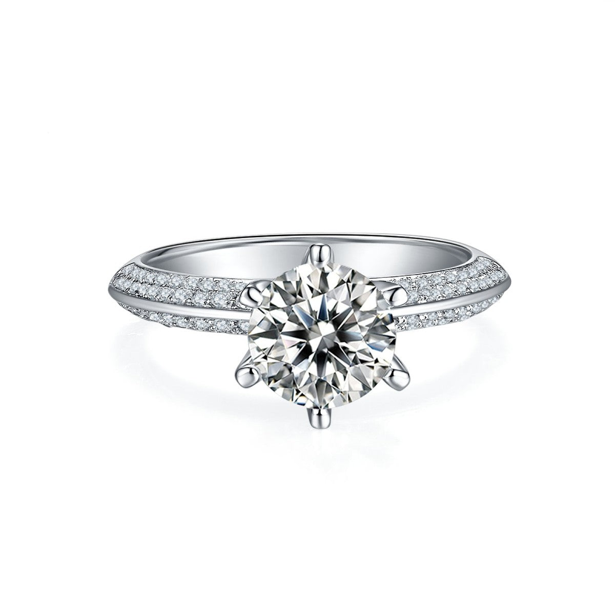 A detailed shot of the ring's halo, highlighting the brilliance of the pave-set stones surrounding the 1.50ct moissanite.