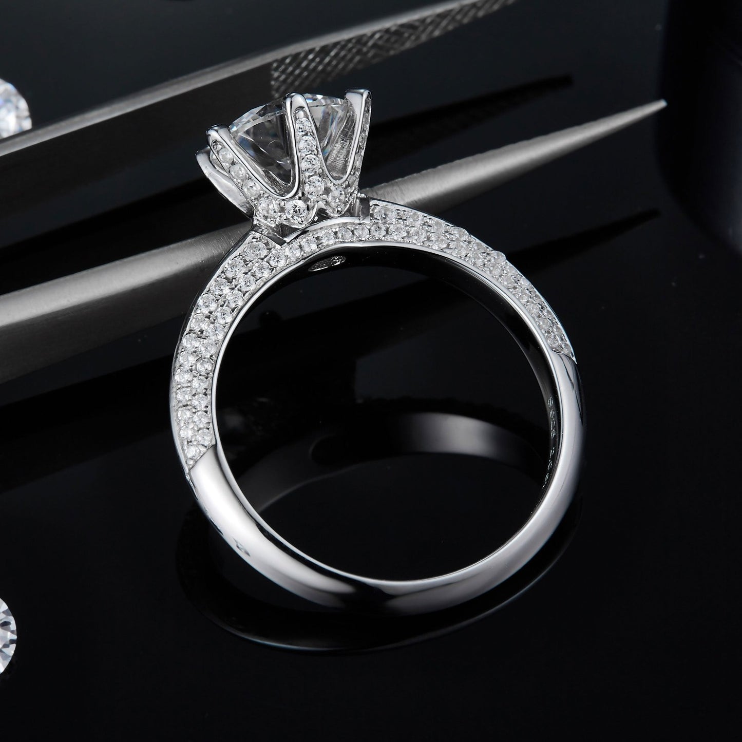 A focused image of the ring's band, showcasing the intricate pave setting and the overall sparkle of the ring.