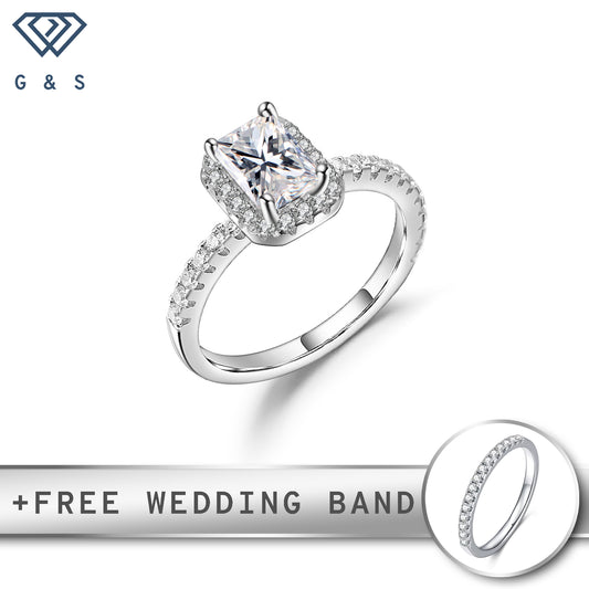 A classic and elegant engagement ring featuring a 1.00ct emerald cut moissanite surrounded by a sparkling halo of smaller stones, set in polished sterling silver.