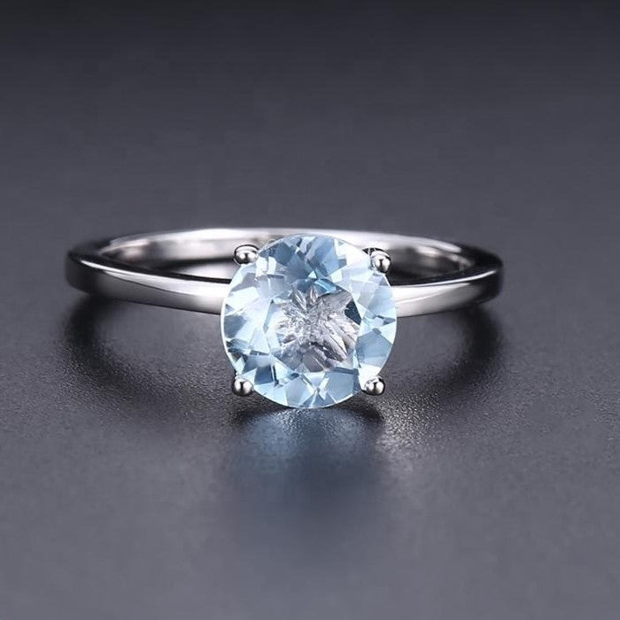 Classic 4 Claw Blue Topaz Solitaire Ring