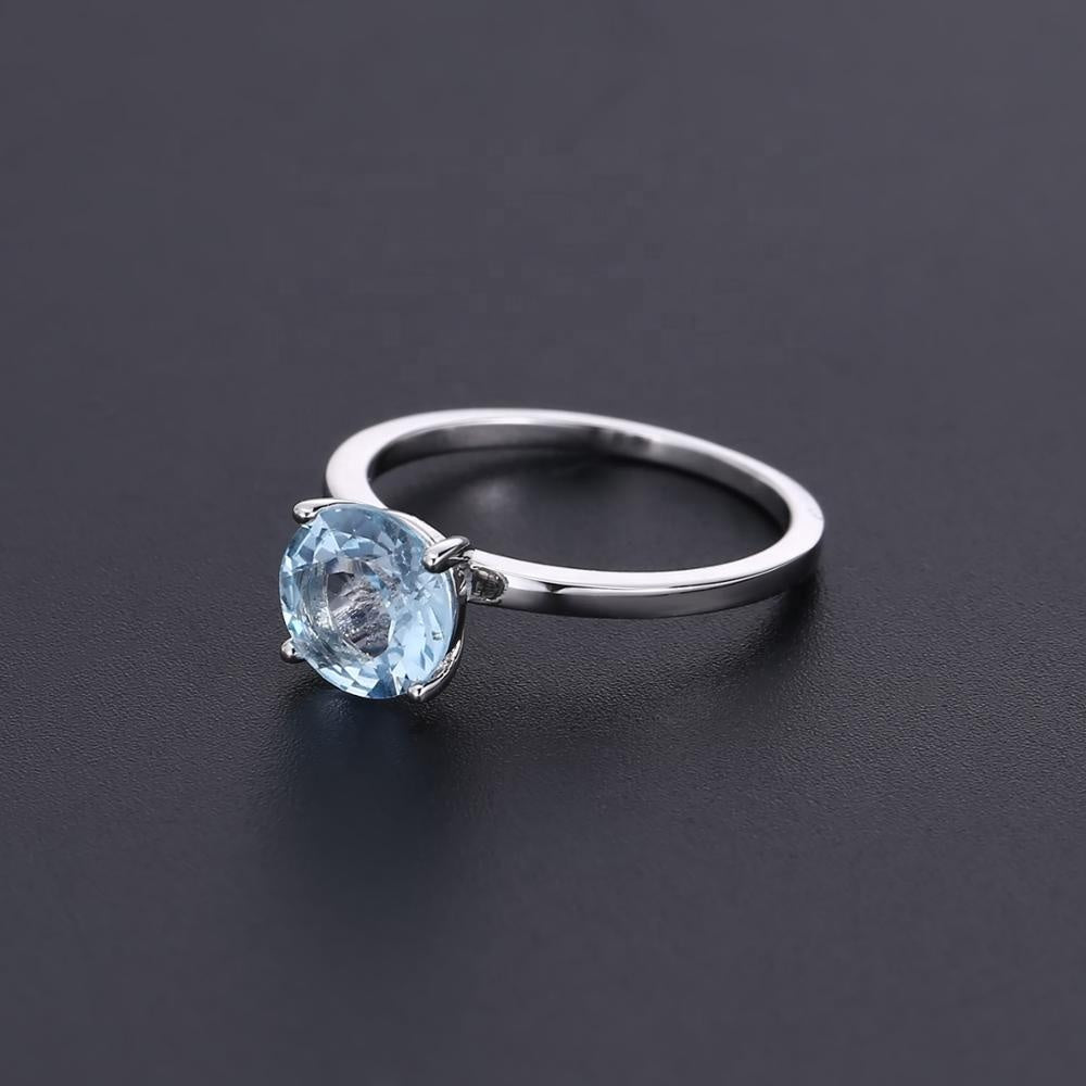 Classic 4 Claw Blue Topaz Solitaire Ring