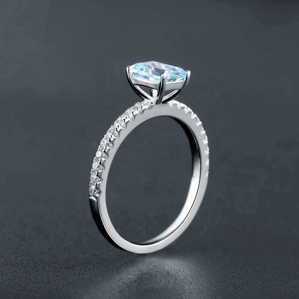 Exquisite Blue Topaz Ring - Emerald Cut