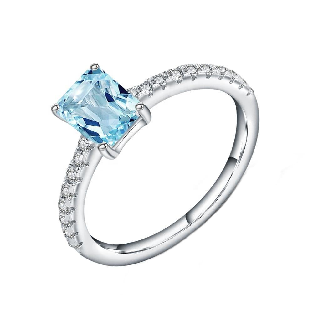 Exquisite Blue Topaz Ring - Emerald Cut