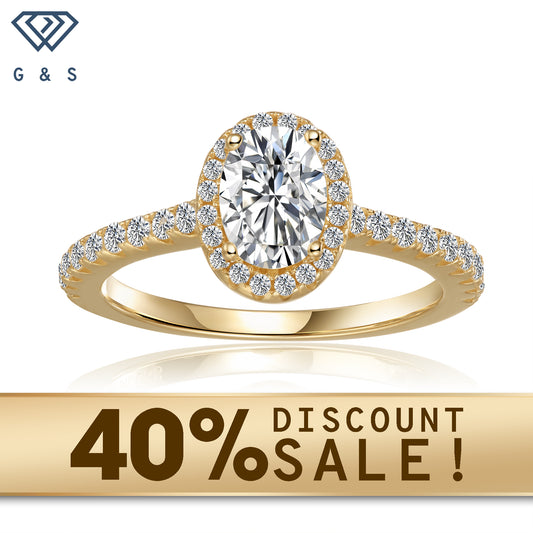 A captivating 9ct yellow gold engagement ring featuring a 1.00ct oval-cut moissanite, encircled by a sparkling halo of smaller moissanites, creating a breathtaking display of brilliance and elegance.