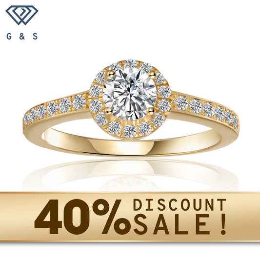 A sparkling 0.50ct moissanite center stone surrounded by a pave halo setting, crafted in warm 9ct yellow gold.